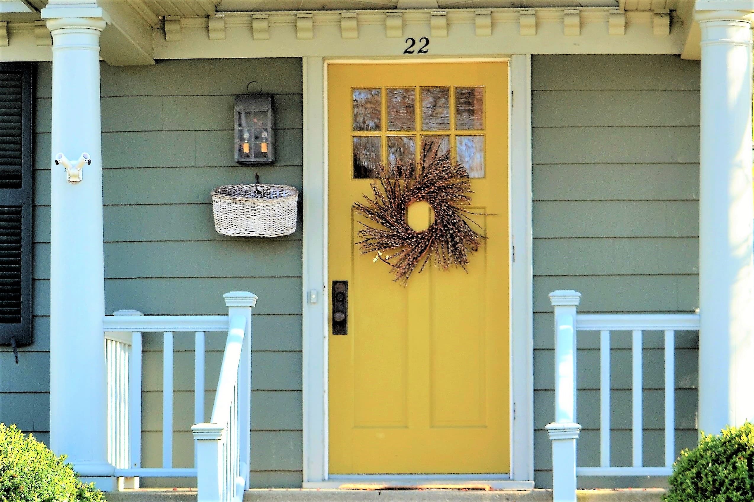 welcoming-front-door-entrance-painted-a-bright-yel-2021-09-01-13-33-31-utc yellow front door
